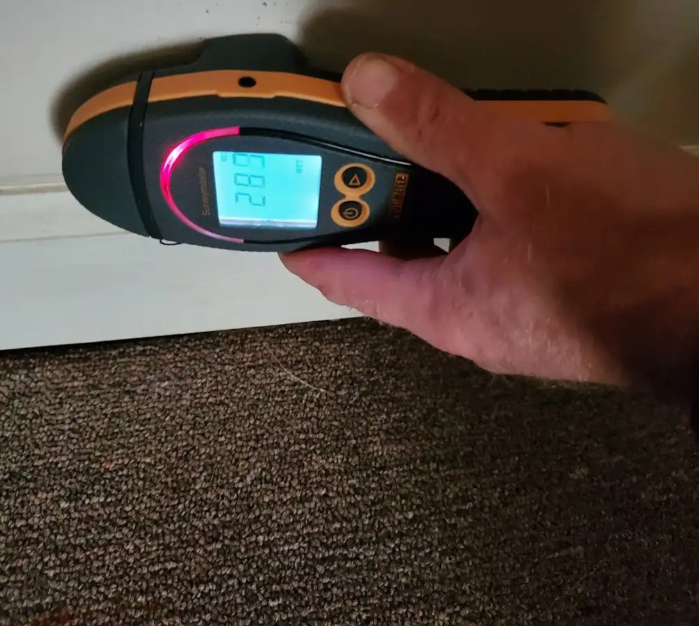 Moisture detection at baseboard during Storm Damage Restoration in Jonesboro